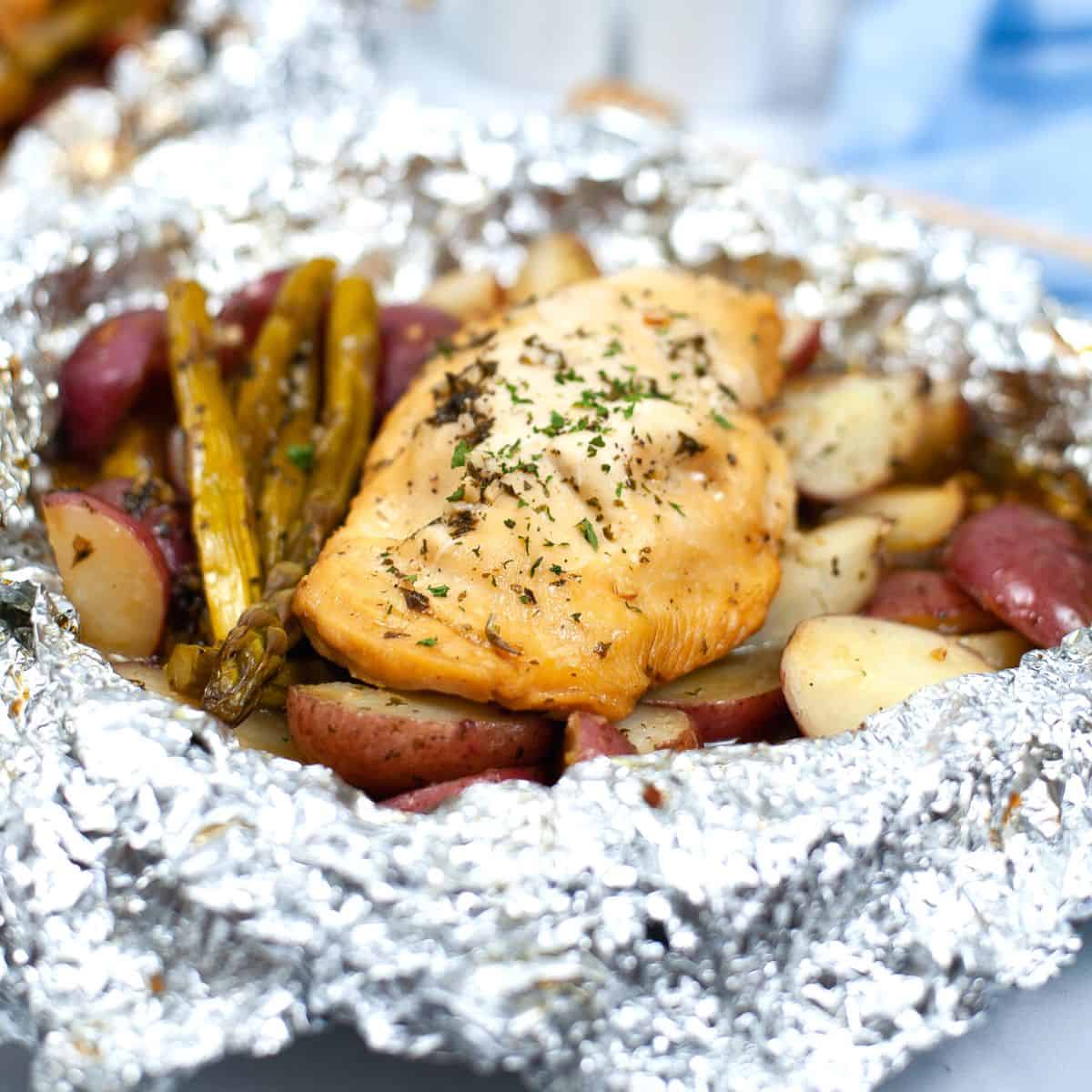 Foil Packet Chicken Breast Dinner, a simple Mediterranean diet friendly individual meal idea that is perfect for barbecues and campfires.