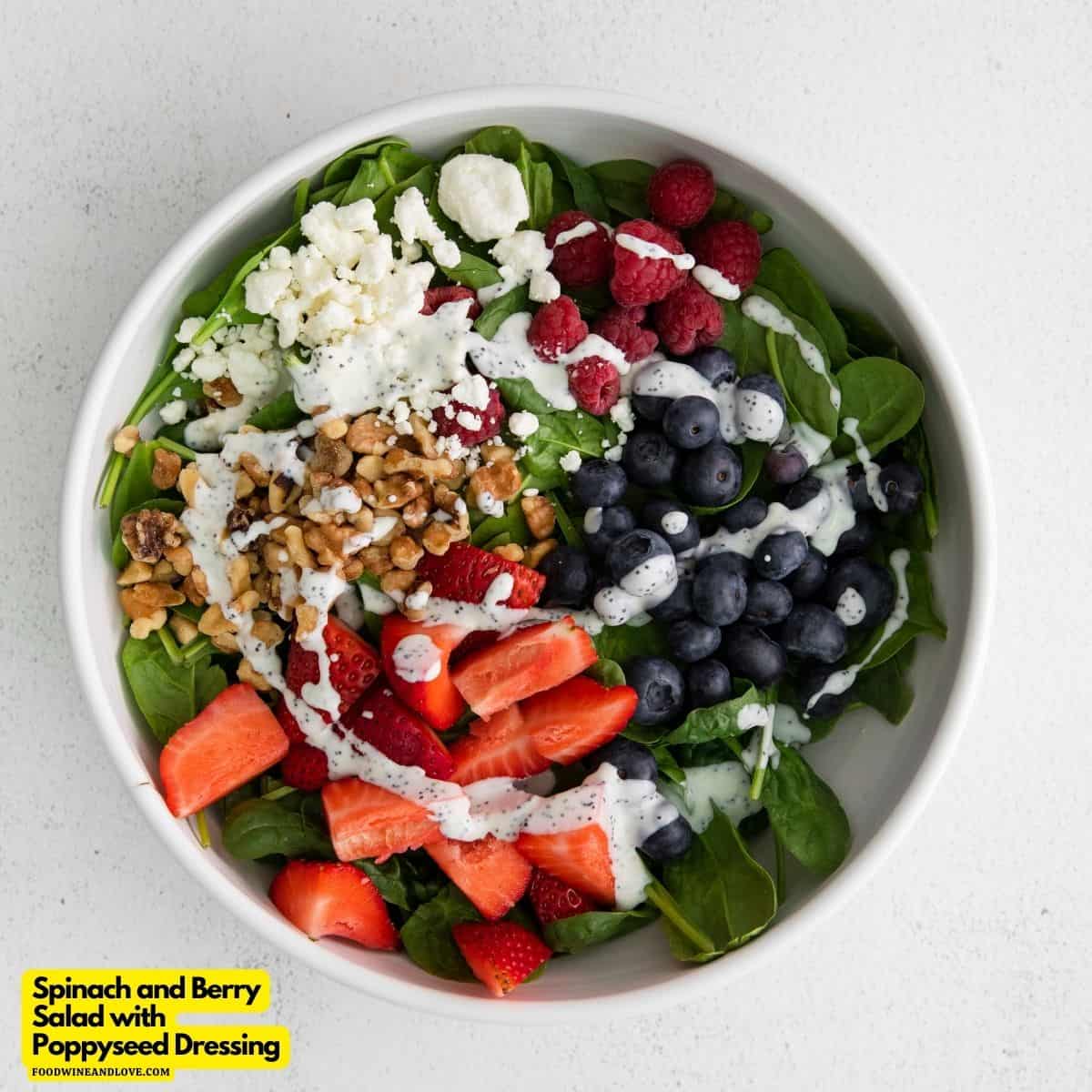 Spinach and Berry Salad with Poppy Seed Dressing, a delicious recipe made with fresh ingredients and topped with creamy honey dijon dressing.