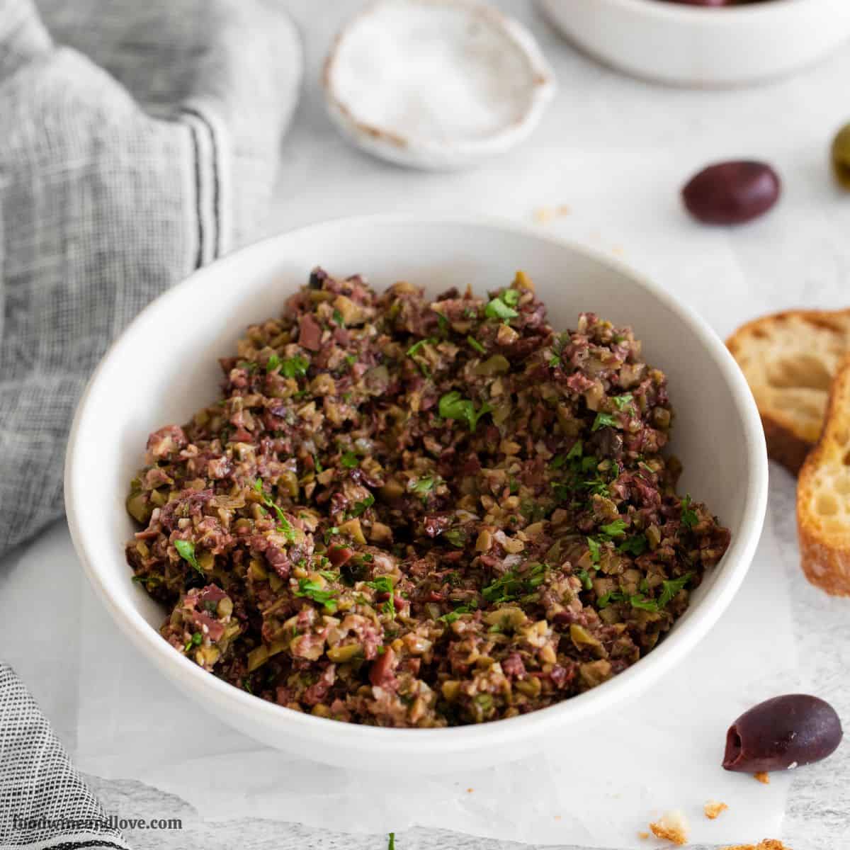 Easy Olive Tapenade Recipe, a delicious quick and easy appetizer or spread recipe made with garlic, basil, and capers.