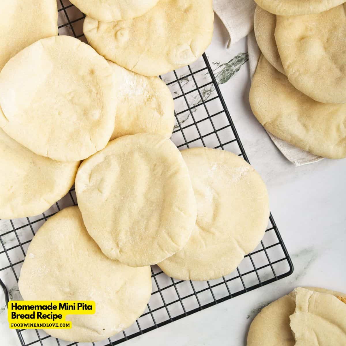 Homemade Mini Pita Bread Recipe, a simple and tasty five ingredients bread that is soft and fluffy. Perfect size for sandwiches or snacking.