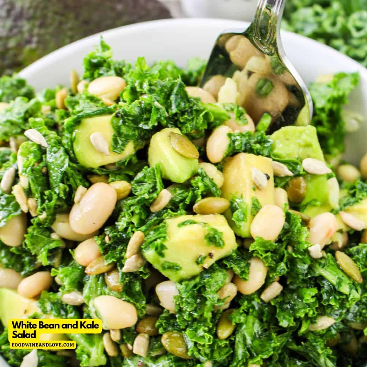 Easy White Bean and Kale Salad, is a protein and flavor packed vegan meal or side dish made with avocado and sunflower seeds.