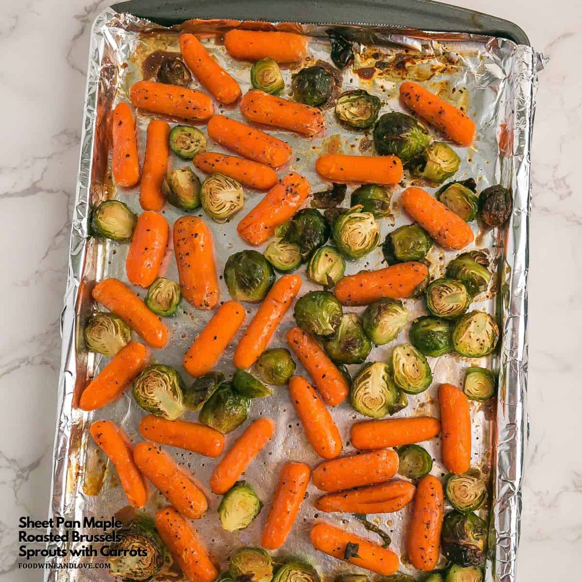 Sheet Pan Maple Roasted Carrots and Sprouts, a simple and delicious healthy side dish made with fresh brussel sprouts and baby carrots.