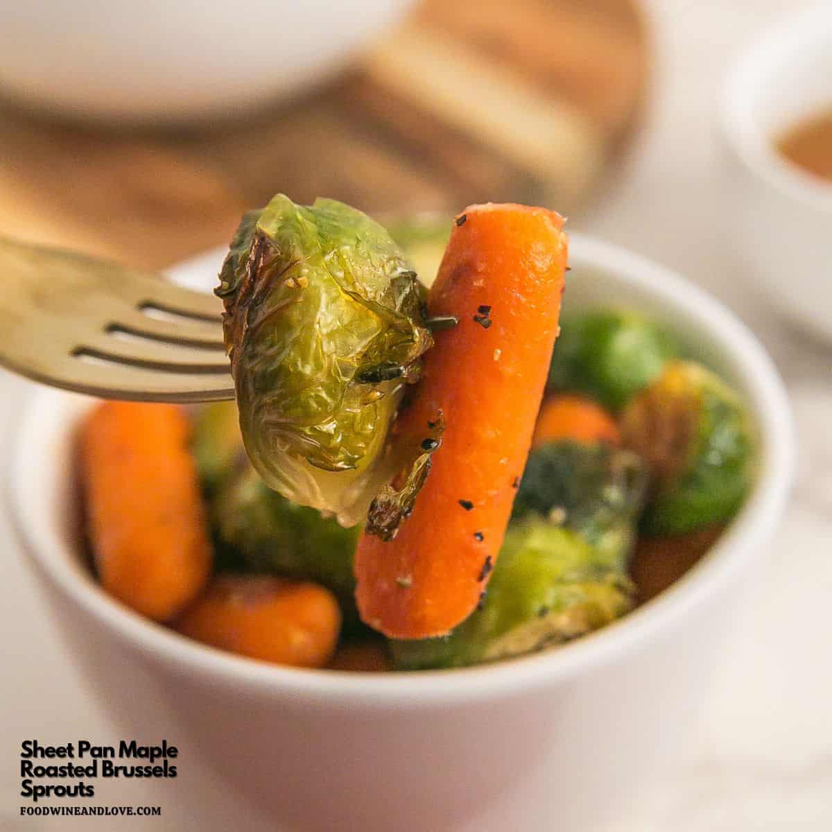 Sheet Pan Maple Roasted Carrots and Sprouts, a simple and delicious healthy side dish made with fresh brussel sprouts and baby carrots.