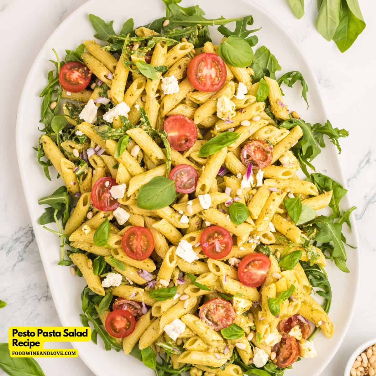 Pesto Pasta Salad Recipe, a vegetarian and Mediterranean diet recipe made with Penne pasta and arugula tossed in a creamy dressing.