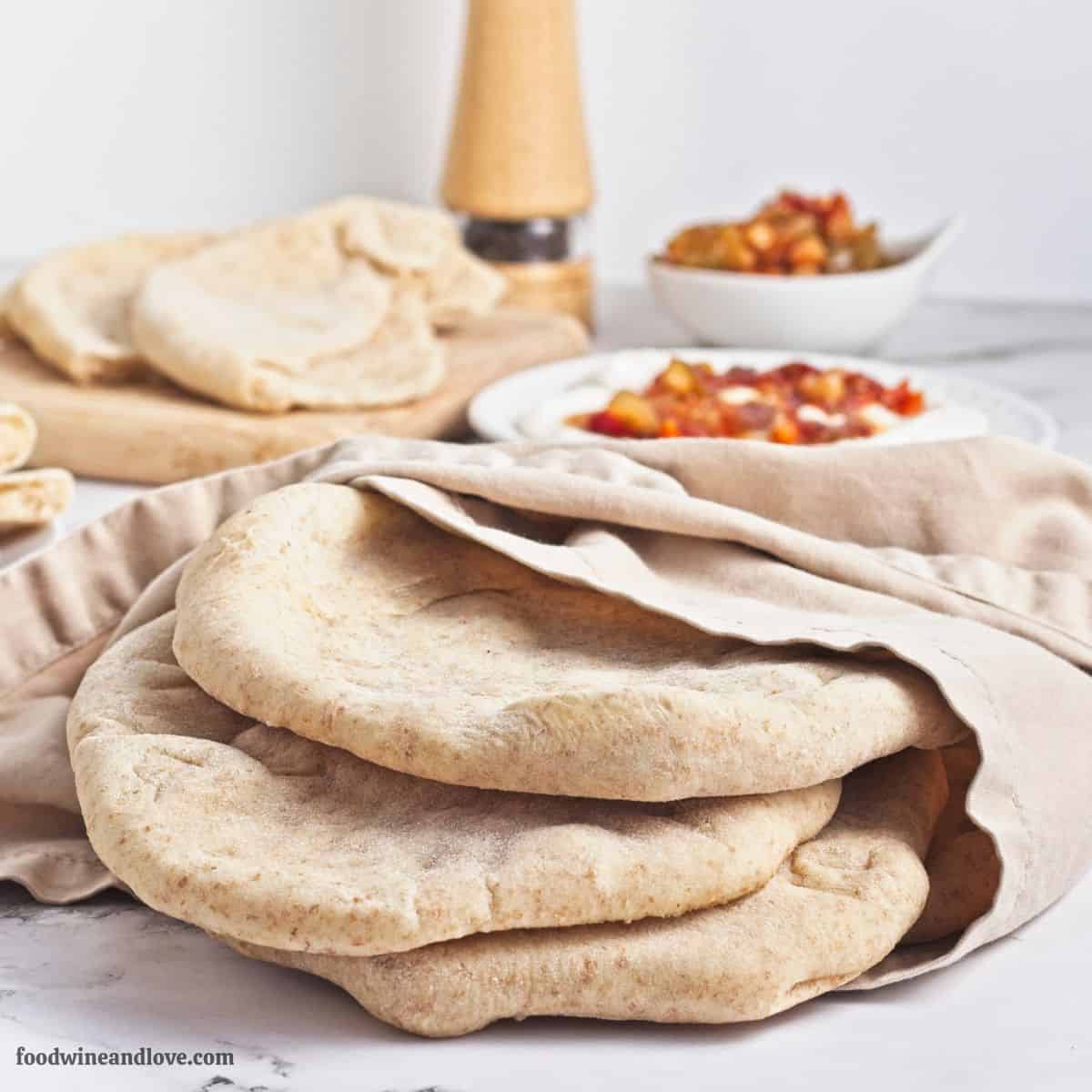 Homemade Whole Wheat Pita Bread, an easy recipe for fluffy and soft pita made with simple pantry ingredients. Vegan Recipe. Homemade Whole Wheat Pita Bread, an easy recipe for fluffy and soft pita made with simple pantry ingredients. Vegan Recipe.